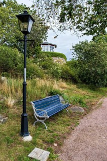 Bench and lantern in the famous allotment garden colony of Brändaholm on the island of Dragsö in