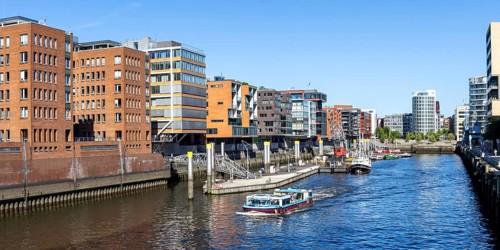 Building in the HafenCity Sandtorhafen harbour with boats panorama in Hamburg, Germany, Europe