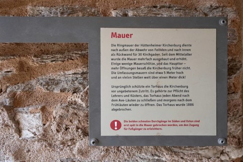 Information board about the curtain wall of the fortified church, Hüttenheim, Lower Franconia,