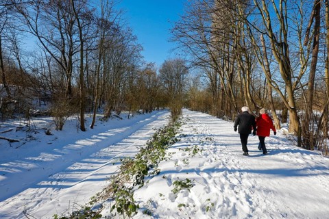 Bochum, North Rhine-Westphalia, Germany - Sunny winter landscape in the Ruhr area, walkers in ice