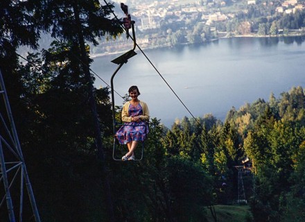 Young woman sitting in chairlift above the Lake Bled, Bled, Slovenia, former Yugoslavia, Europe