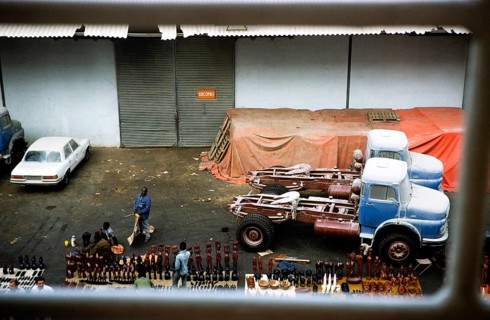 Trucks on the quay and traders with tourist souvenirs, harbour of Dakar, Senegal, West Africa,