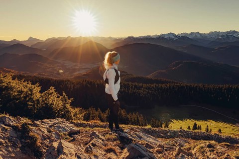 Trail running in autumn on the Jochberg on Lake Walchensee against the wonderful backdrop of the