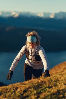 Trail running in autumn on the Jochberg on Lake Walchensee against the wonderful backdrop of the