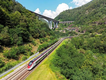 Railway passenger train of the type Stadler Flirt of the Südostbahn on the Gotthard railway Aerial