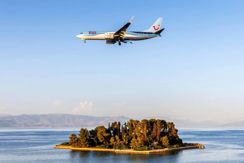 A TUI Boeing 737-800 aircraft with the registration G-TAWX at Corfu Airport, Greece, Europe