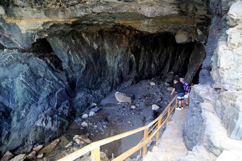 People exploring the sea caves at Ajuy, Fuerteventura, Canary Islands, Spain, Europe