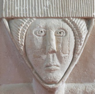 Stonework carved head of woman, church of Saint Michael, Yanworth, Gloucestershire, England, UK