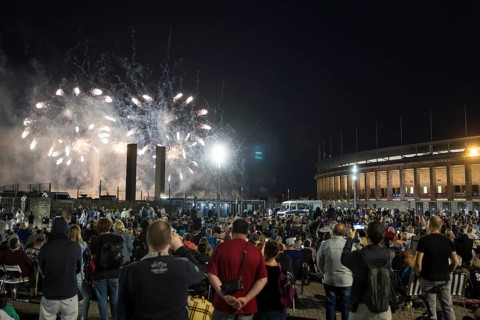 Spectators watch the fireworks at the Pyronale on the Maifeld at the Olympic Stadium, Berlin,