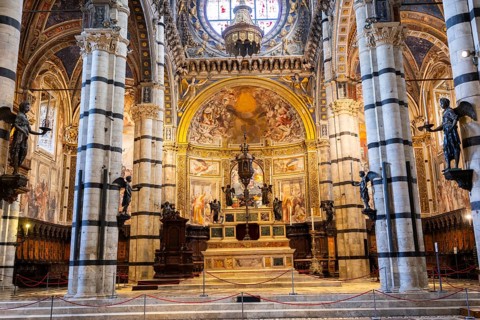 Interior with striped columns and decorated ceiling, Siena Cathedral or Cattedrale di Santa Maria