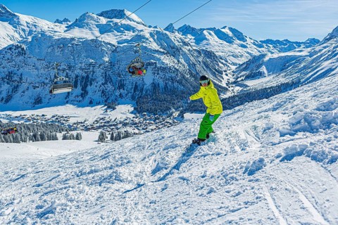 Snowboarders in the Lech Zürs ski resort near Lech, Austria, Europe