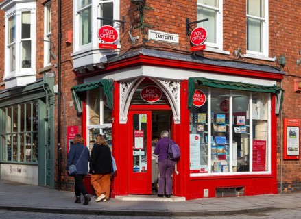 Post Office corner shop painted bright red, Eastgate, Bailgate, Uphill area of city of Lincoln,