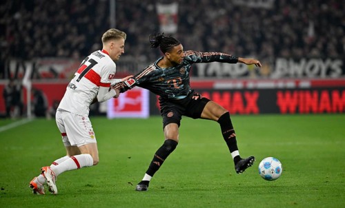 Tackle, action foul holding Chris Führich VfB Stuttgart (27) v Michael Olise FC Bayern Munich FCB