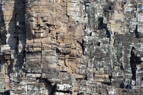 Panoramic image of giant stone-carved faces of the Bodhisattva Lokeshvara, also known as