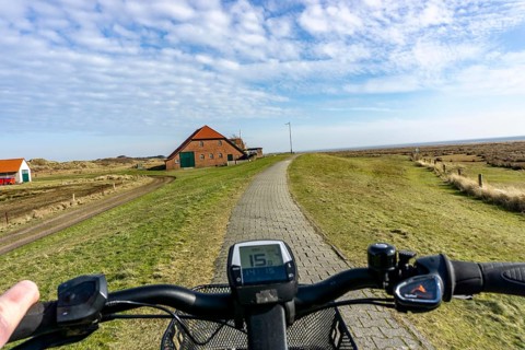 The East Frisian North Sea island of Juist in winter, cycling in the west of the island, on dyke