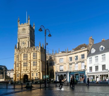 Historic buildings in market place and parish Church of St John Baptist, Cirencester,