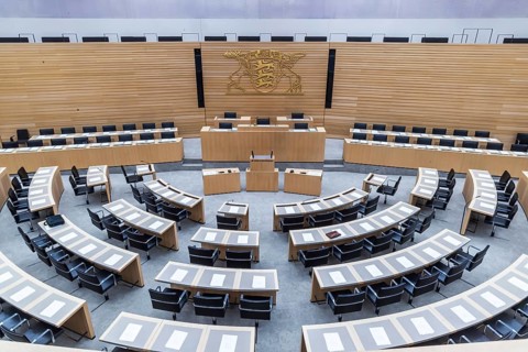 State parliament of Baden-Württemberg. Empty plenary hall, state coat of arms. Stuttgart,