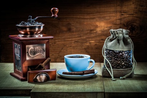 Cup with coffee mill sack and scoop