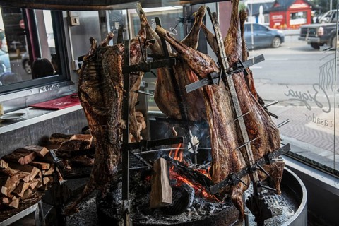 Sheep being cooked on a large grill, Ushuaia, Argentina, South America