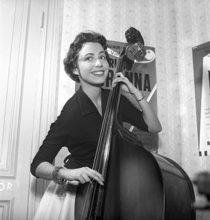 Girl in 1956. The photograph, taken in 1956, portrays a young woman with a bright smile as she
