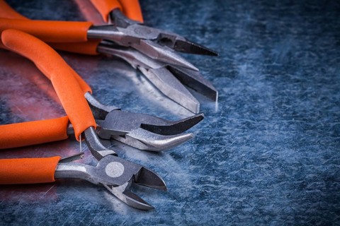 Collection of insulated cutting pliers gripping tongs with rubber handles