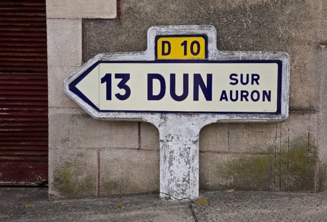 Historic ceramic and concrete signpost, D 10 13 DUN SUR AURON