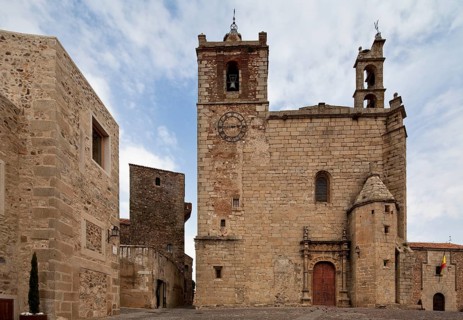 South-west façade with Plateresque main portal at the back left Torre de los Plata
