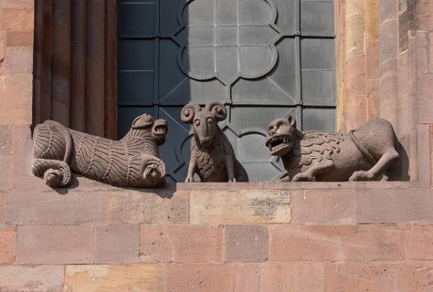 Worms, St Peter's Cathedral, east choir, figures under the large windows: lions and rams