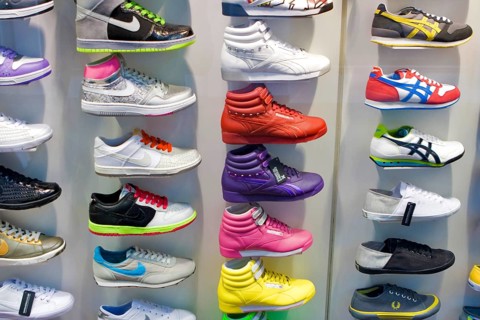 Colourful decorative shoes for sale in store, London, UK United Kingdom England