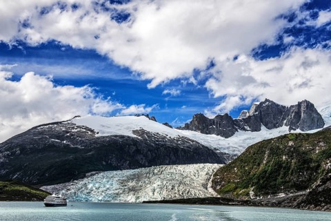 Cruise ship Stella Australis anchored in front of Pia Glacier, Cordillera Darwin, north-east