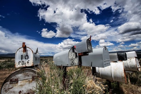 Letterboxes, mailboxes, cumulus clouds Highway 50, Loneliest Road in America, Ely, Nevada, USA,