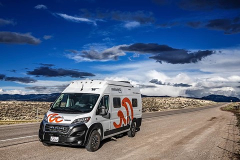 Motorhomes in the midst of wild thunderstorms and rain clouds, on the Great Basin Highway US 93,