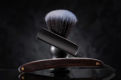 Black Barber Tools. Stright Razor And Classic Shaving Brush On Abstract Background