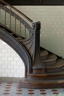 Staircase post with iron bands in Art Nouveau style