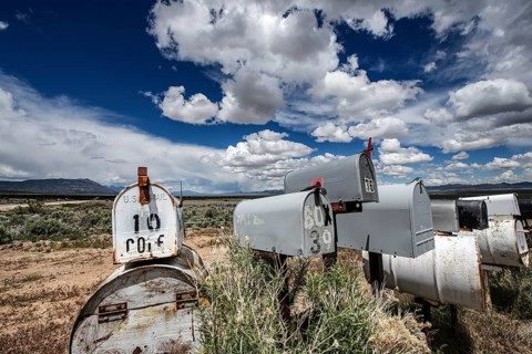 Letterboxes, mailboxes, cumulus clouds Highway 50, Loneliest Road in America, Ely, Nevada, USA,