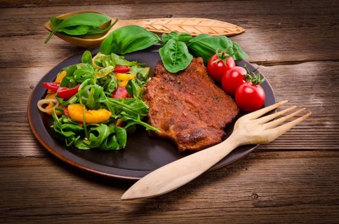 Cervical chop with apricot-rocket salad