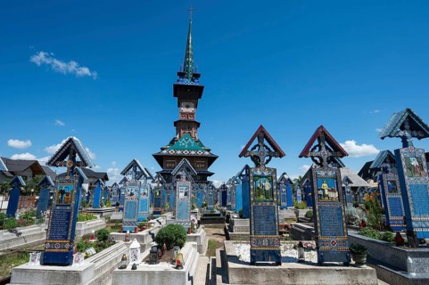 SAPANTA, ROMANIA - JUNE 24, 2024: Graves at famoues merry cemetery