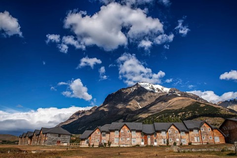 Log cabins at the entrance to Torres del Paine National Park, Patagonia, Chile, South America