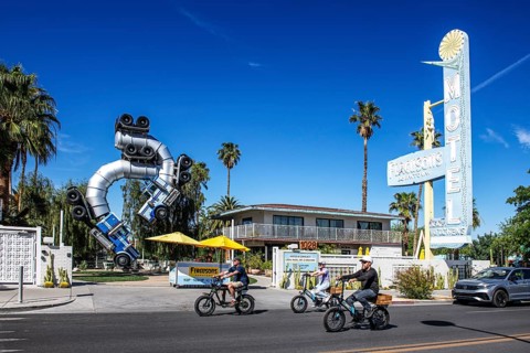 Cyclist in front of truck artwork, Fergusons Motel, Las Vegas, Nevada, USA, North America