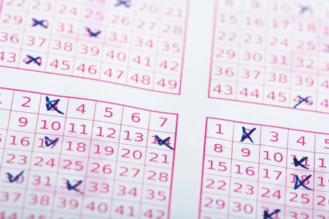 Marked lottery ticket close up. Studio shot