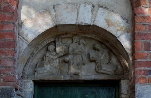 Foundation tympanum, St Anne carrying Mary, on the left son Krystyn of the founder Piotr