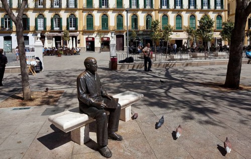 Bronze seated figure in front of his birthplace on the Plaza de la Merced