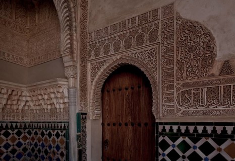 Nasrid Palace, wall design around a door with stucco framing and tiled plinth