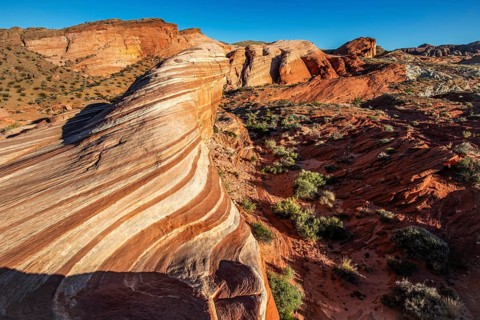 Hikers on the Fire Wave, Valley of Fire State Park, Nevada, USA, North America