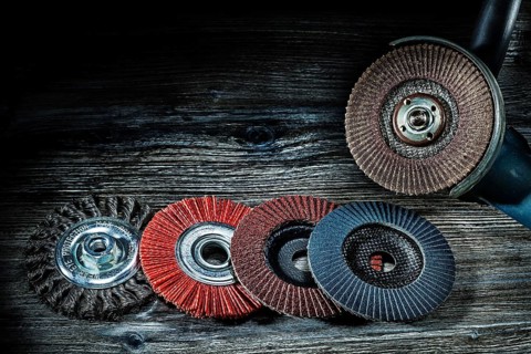 Angle sander mashine with random sanding wheels on vitage wood