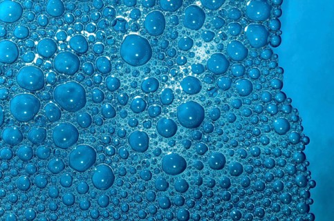 Pattern of soap surf bubbles in blue coloured water 28/12/2008