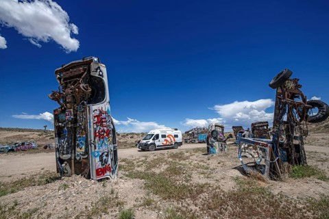 Motorhome and scrap cars decorated with graffiti in the Carforest of Goldfield, Nevada, USA, North