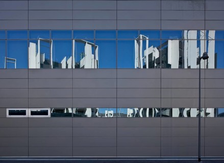 Residential development on Via Traiano, built in 2009-2014 by Guido Canali, reflection in the