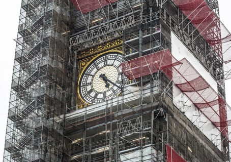 London, Big Ben clock face in the centre of the scaffolding