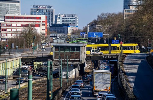 Motorway A40, Ruhr expressway, heavy traffic jam, rush hour, city passage in Essen, skyline of the